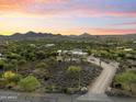 Aerial view of a single-story home on a large lot with desert landscaping at 5730 E Cielo N Run, Cave Creek, AZ 85331