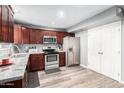 Updated kitchen featuring stainless steel appliances and wood cabinets at 6622 N 43Rd Ave, Glendale, AZ 85301