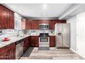 Modern kitchen with stainless steel appliances and granite countertops at 6622 N 43Rd Ave, Glendale, AZ 85301