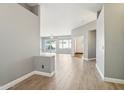 Bright entryway with wood-look floors and views to the living room at 7138 E Laguna Azul Ave, Mesa, AZ 85209