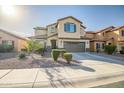 Two-story house with a brown garage door and landscaping at 10789 W Saddlehorn Rd, Peoria, AZ 85383