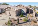 Single-story home with desert landscaping and two-car garage at 11038 W Tonto Ln, Peoria, AZ 85373