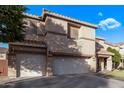 Two-story house with a three-car garage and well-manicured lawn at 11868 W Kinderman Dr, Avondale, AZ 85323