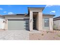 Inviting single-story home featuring stone accents, low-maintenance landscaping, and a spacious two-car garage at 20316 W Turney Ave, Buckeye, AZ 85396