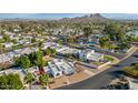 Aerial view of a residential neighborhood with mountains in the background at 26 E Boca Raton Rd, Phoenix, AZ 85022