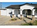 Updated craftsman home with welcoming porch and stone columns at 3738 W Roeser Rd, Phoenix, AZ 85041