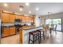 Spacious kitchen featuring an island and stainless steel appliances at 44192 W Canyon Creek Dr, Maricopa, AZ 85139