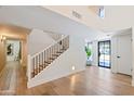 Elegant staircase with black metal railing and light wood steps at 5112 N 35Th St, Phoenix, AZ 85018