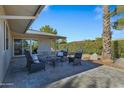 Backyard patio with seating area, offering a relaxing outdoor space at 12424 W Bluestem Dr, Sun City West, AZ 85375