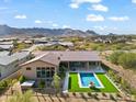 Aerial view showing a house with a pool, spa, and a large backyard at 13222 E Ranch Gate Rd, Scottsdale, AZ 85255