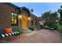 Inviting front patio with brick pavers and seating area at 1325 W Lynwood St, Phoenix, AZ 85007