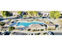 Community pool and spa viewed from above, along with surrounding homes at 1421 N 80Th Ln, Phoenix, AZ 85043