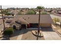 Single story home with desert landscaping and a driveway at 14731 W Trading Post Dr, Sun City West, AZ 85375