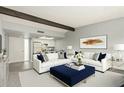 Bright living room with white sofas, blue accents, and an open layout to the kitchen at 16807 E Gunsight Dr # B23, Fountain Hills, AZ 85268