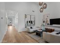 Bright and airy living room with hardwood floors and comfortable seating at 17708 N 92Nd St, Scottsdale, AZ 85255