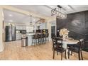 Modern kitchen with light blue cabinets, granite countertops, and an island at 22183 N 178Th Ave, Surprise, AZ 85387