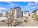 Attractive curb appeal with drought-tolerant landscaping at 23120 E Twilight Dr, Queen Creek, AZ 85142