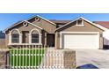 Newly built home with a two-car garage and artificial turf at 2716 N 88Th Ln, Phoenix, AZ 85037