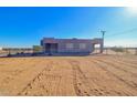 House exterior with a fenced yard and desert landscape at 3015 W Paraiso Dr, Eloy, AZ 85131