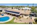 Aerial view of the backyard oasis, complete with a sparkling pool and solar panels at 3357 E Gold Dust Ave, Phoenix, AZ 85028