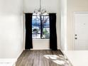 Bright dining area with large window and hardwood floors at 3427 E Lance Ln, Phoenix, AZ 85018