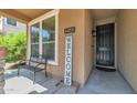 Front porch with a bench and welcome sign at 3548 E Mesquite St, Gilbert, AZ 85296