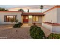 Front entry with red door and tile walkway at 4842 E Surrey Ave, Scottsdale, AZ 85254