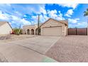 House exterior showcasing desert landscaping and a gated driveway at 4963 E Hobart St, Mesa, AZ 85205