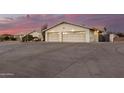 Two-car garage with large concrete driveway at 51008 N 295Th Ave, Wickenburg, AZ 85390