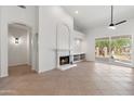 Bright living room with fireplace and tile flooring at 8965 E Maple Dr, Scottsdale, AZ 85255