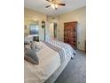 Bright bedroom with a comfortable bed and ample closet space at 10030 W Indian School Rd # 101, Phoenix, AZ 85037