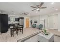 Open living room, dining area, and kitchen with light wood floors at 1022 E Mariposa St, Phoenix, AZ 85014