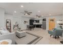 Open living room, dining area, and kitchen with light wood floors at 1022 E Mariposa St, Phoenix, AZ 85014