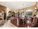 Spacious dining room with hardwood floors and elegant chandelier at 10638 E Blanche Dr, Scottsdale, AZ 85255