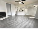 Bright and spacious living room with fireplace and wood-look flooring at 1331 W Baseline Rd # 244, Mesa, AZ 85202