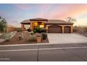 Stunning curb appeal with a three-car garage and desert landscaping at 15639 E Palomino Blvd, Fountain Hills, AZ 85268