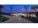 Luxury home with a curved driveway and desert landscaping at 16439 E Nicklaus Dr, Fountain Hills, AZ 85268