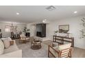 Bright and airy living room featuring a modern fireplace and comfortable seating at 1741 N Lehmberg Ave, Casa Grande, AZ 85122