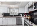 Updated kitchen, featuring granite countertops and stainless steel appliances at 19098 N 97Th Ln, Peoria, AZ 85382