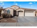 Beautiful one-story home with a two-car garage and landscaped front yard at 19146 W Pasadena Ave, Litchfield Park, AZ 85340