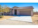 Single-story home with stone accents and a two-car garage at 19350 W Clarendon Ave, Litchfield Park, AZ 85340