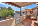 Inviting front patio features comfortable seating and desert plants at 221 E Nebraska St, Florence, AZ 85132