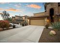 Two-story stucco home with double garage and drought-tolerant landscaping at 2425 W Bronco Butte Trl # 2037, Phoenix, AZ 85085