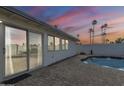 Relaxing pool area with brick pavers and sliding glass doors at 2818 S Cottonwood Dr, Tempe, AZ 85282