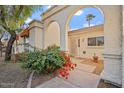 Front entry with arched walkway and bougainvillea at 4079 E Yucca St, Phoenix, AZ 85028