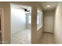 Bright hallway with tile flooring and access to other rooms at 42025 W Manderas Ln, Maricopa, AZ 85138