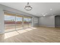 Bright living room with tile floors and sliding glass doors at 4257 E John St, Gilbert, AZ 85295