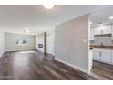 Bright living room with fireplace and wood-look floors at 4346 E Earll Dr, Phoenix, AZ 85018