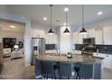 Granite kitchen island with stainless steel appliances at 5927 E Sienna Bouquet Pl, Cave Creek, AZ 85331