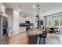 Modern kitchen with granite island and stainless steel appliances at 5927 E Sienna Bouquet Pl, Cave Creek, AZ 85331